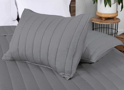 Arctic Coverlet detail shot of two shams on bed in bedroom #choose-your-color_charcoal