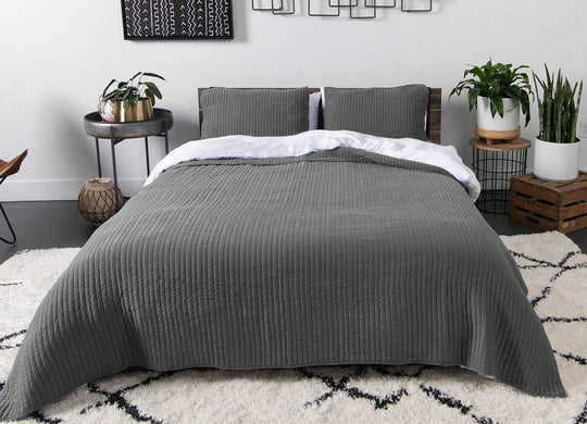 Arctic Quilt Set in charcoal on bed in bedroom environment #choose-your-color_charcoal