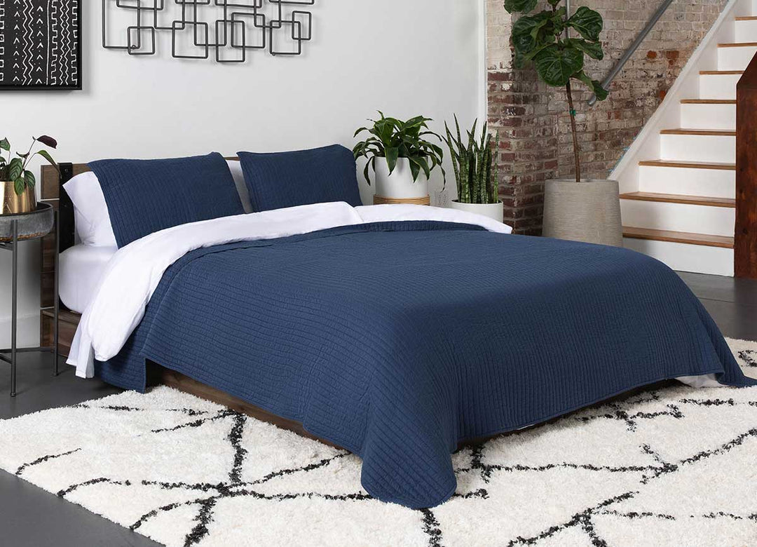 Arctic Quilt Set in denim in bedroom environment. #choose-your-color_denim