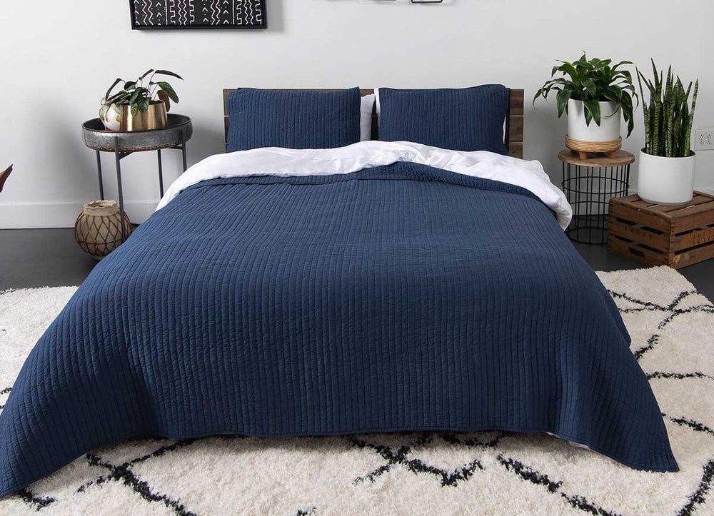 Arctic Quilt Set in denim in bedroom environment. #choose-your-color_denim