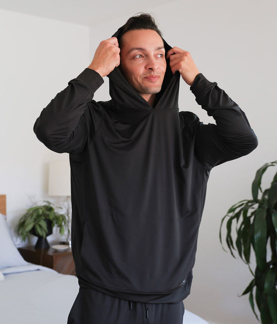 Model wearing black SHEEX Men's Hoodie #choose-your-color_black