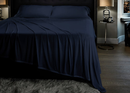 Midnight Label Sheet Set shown on bed #choose-your-color_nightfall