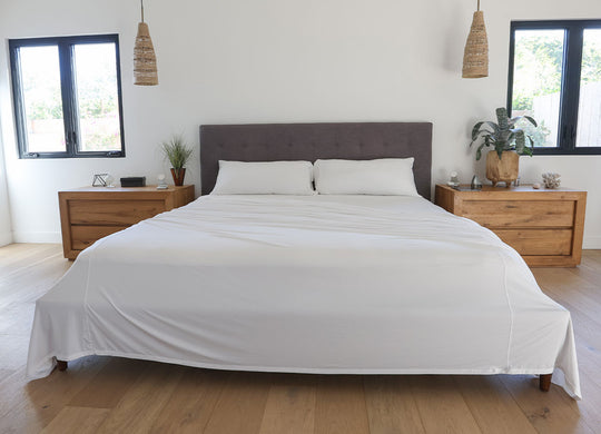 Bright White sheet set shown on bed in bedroom environment. #choose-your-color_bright-white