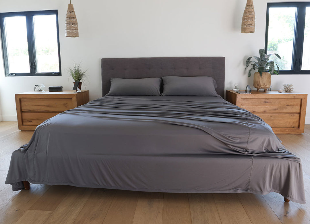 Graphite sheet set shown on bed in bedroom environment. #choose-your-color_graphite