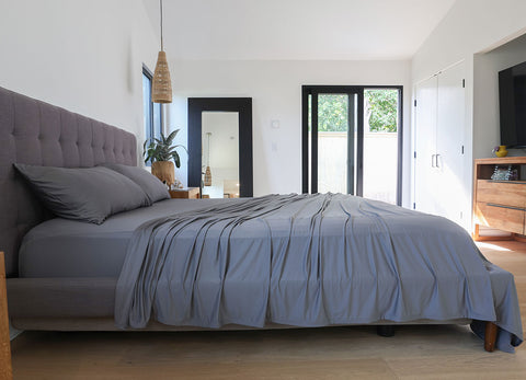 Graphite sheet set shown on bed in bedroom environment. #choose-your-color_graphite