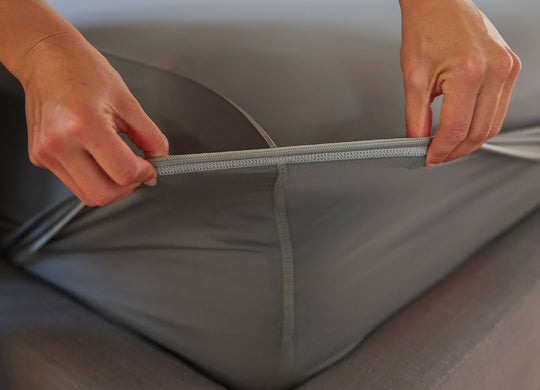 Graphite fitted sheet shown on deep pocket mattress in bedroom environment. #choose-your-color_graphite