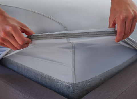 Pearl Blue fitted sheet elastic shown on deep pocket mattress in bedroom environment. #choose-your-color_pearl-blue